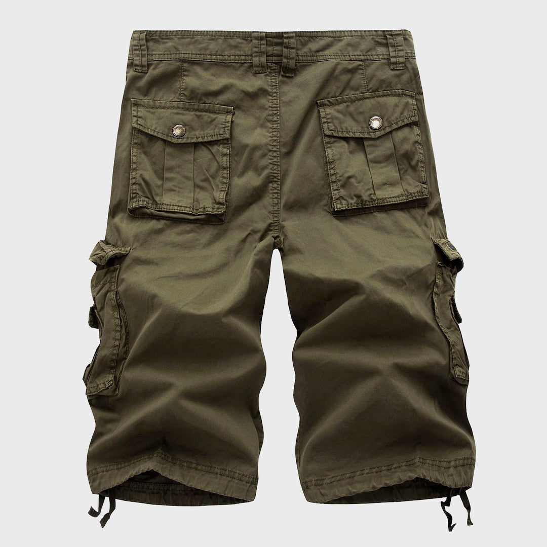 Men's Cole knee-length olive green cargo shorts with multi-pocket design and adjustable drawstring hems.