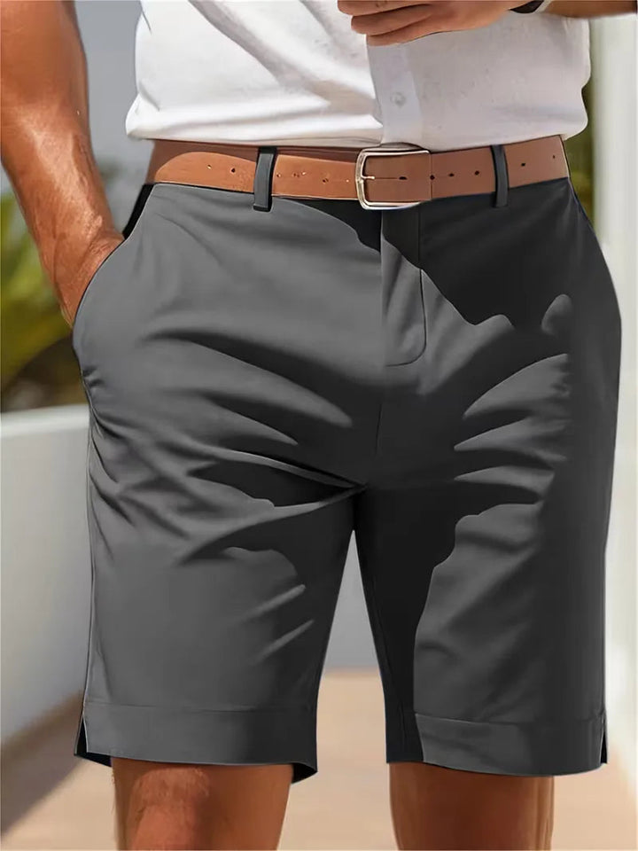 Men's Cole lightweight straight leg shorts in charcoal gray polyester with a tan belt, perfect for warm days.