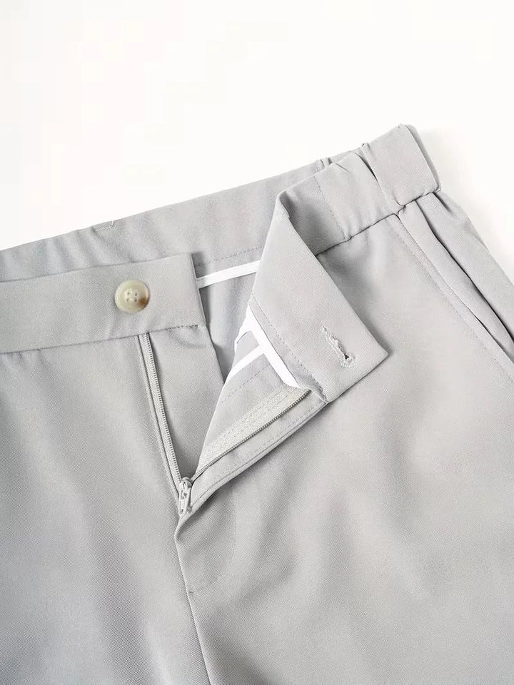 Light gray Cole men's lightweight straight leg shorts, featuring a button, zipper fly, and belt loops.