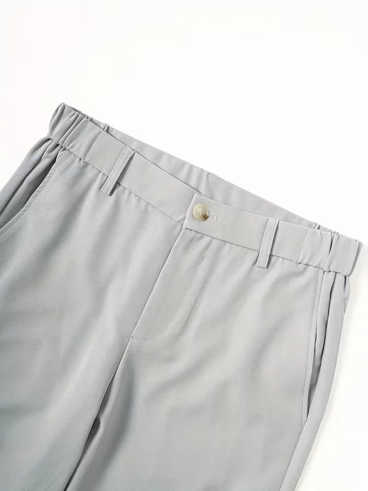 Light gray Cole men's lightweight straight leg shorts with an elastic mid-rise waist, button closure, belt loops, and side pockets.