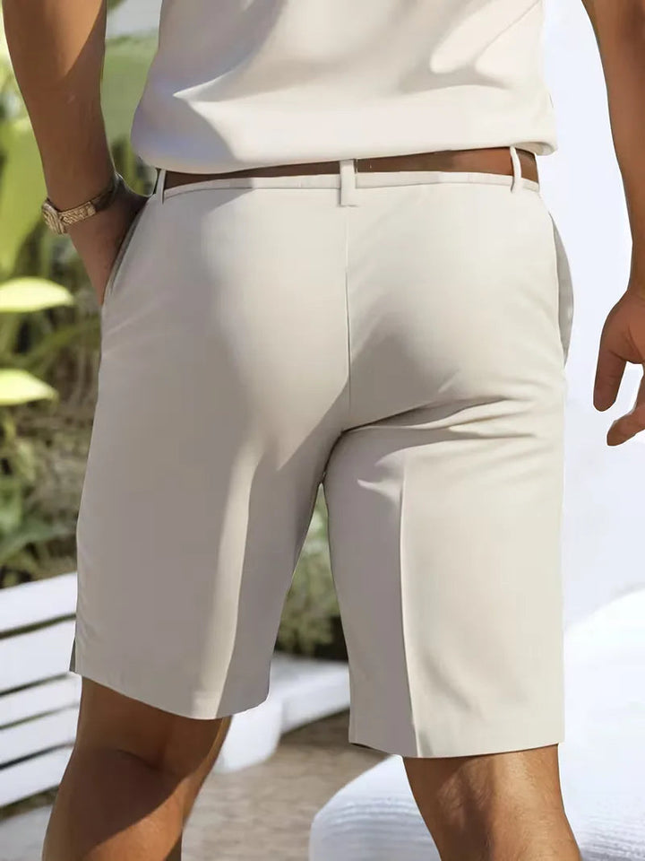 Men's Cole lightweight straight leg shorts in a clean, relaxed light beige, with a brown belt and side pockets.