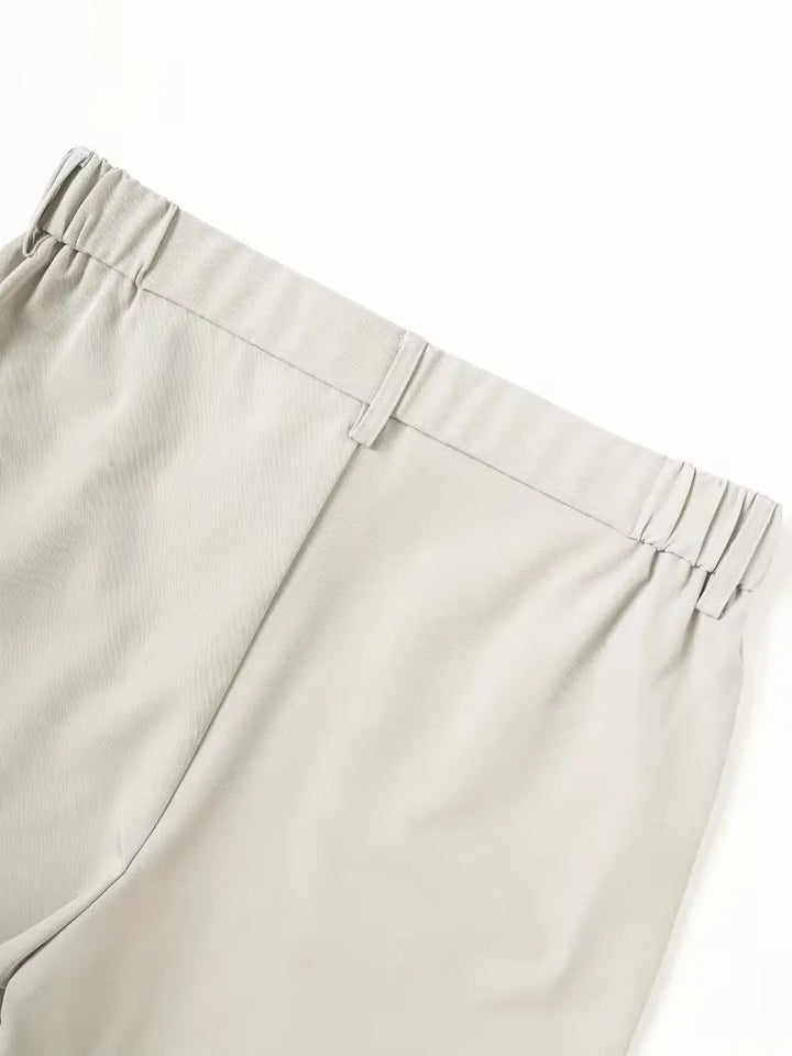 Lightweight Cole men's straight leg shorts in a clean, balanced light gray polyester, featuring an elasticized mid-rise waist and belt loops.