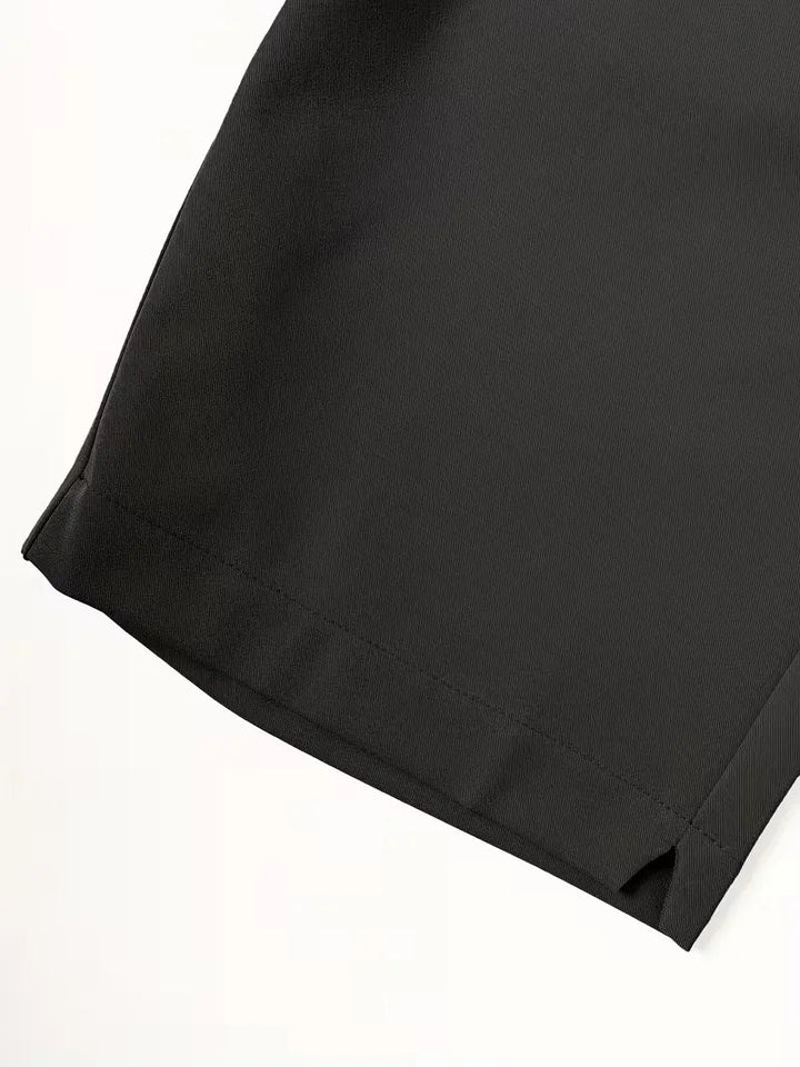 Cole men's black lightweight straight leg shorts, showcasing the clean hem and breathable polyester fabric.