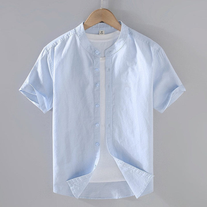 Cole Men's light blue short sleeve linen shirt with a stand collar and full button-front closure.