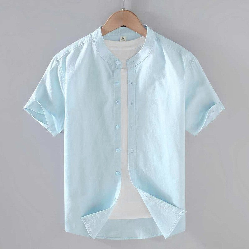 Men's Cole light blue short sleeve linen shirt with stand collar and full button-front closure.