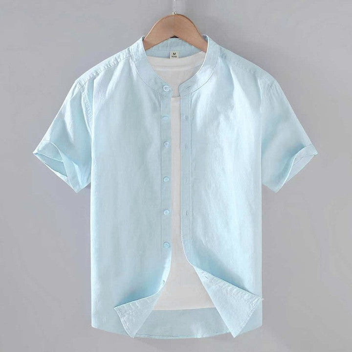 Men's Cole light blue short sleeve linen shirt with stand collar and full button-front closure.