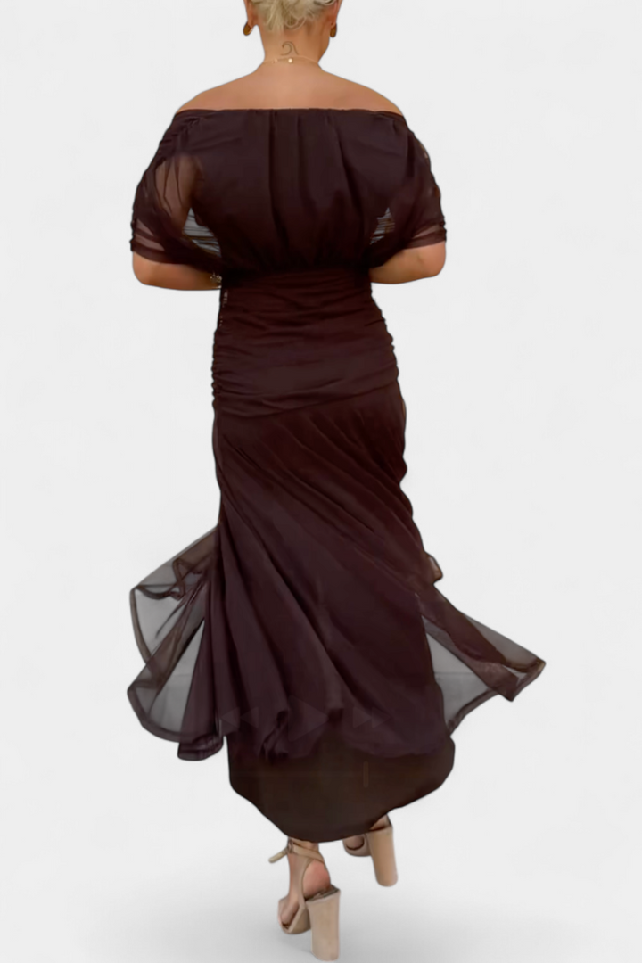 Women's floral off-shoulder maxi dress with a ruched waist, flowing skirt, and vibrant print.
