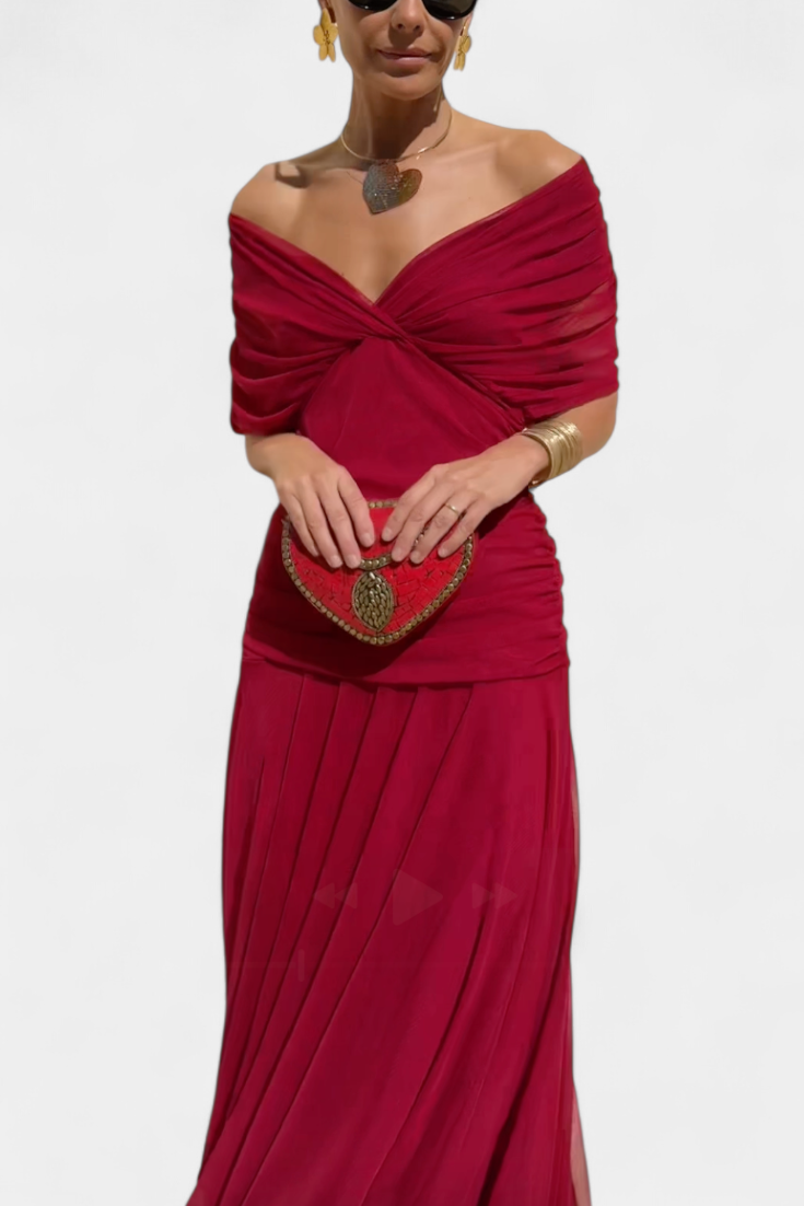 Women's floral off-shoulder maxi dress with a ruched waist, flowing skirt, and vibrant print.