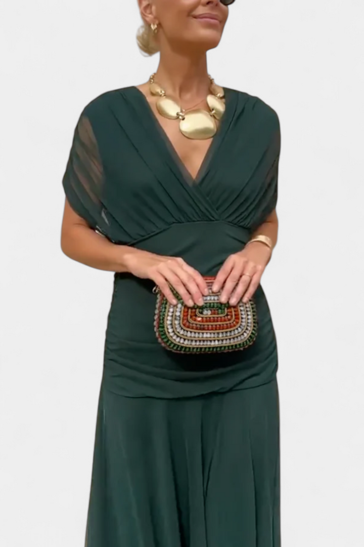 Women's floral off-shoulder maxi dress with a ruched waist, flowing skirt, and vibrant print.