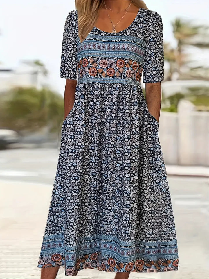 Women's square neck boho printed midi dress with short sleeves, shirred bodice, tiered skirt, and pockets.
