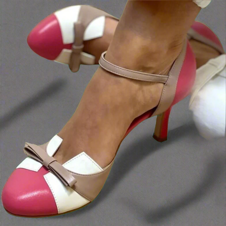 Daphne orthopedic ankle strap heels in a pink, white, and beige colorblock design with a bow accent.