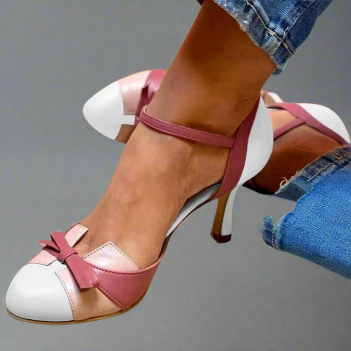 Daphne colorblock ankle strap heels in pink and white with a bow detail, worn with blue jeans.