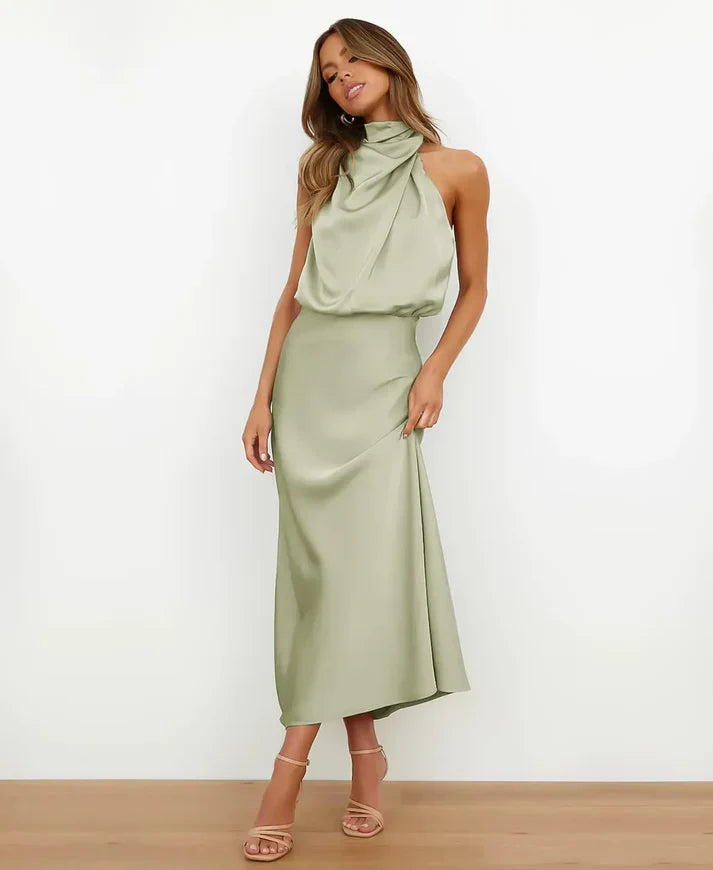 Sage green satin halter midi dress with a draped high neckline and slim silhouette.