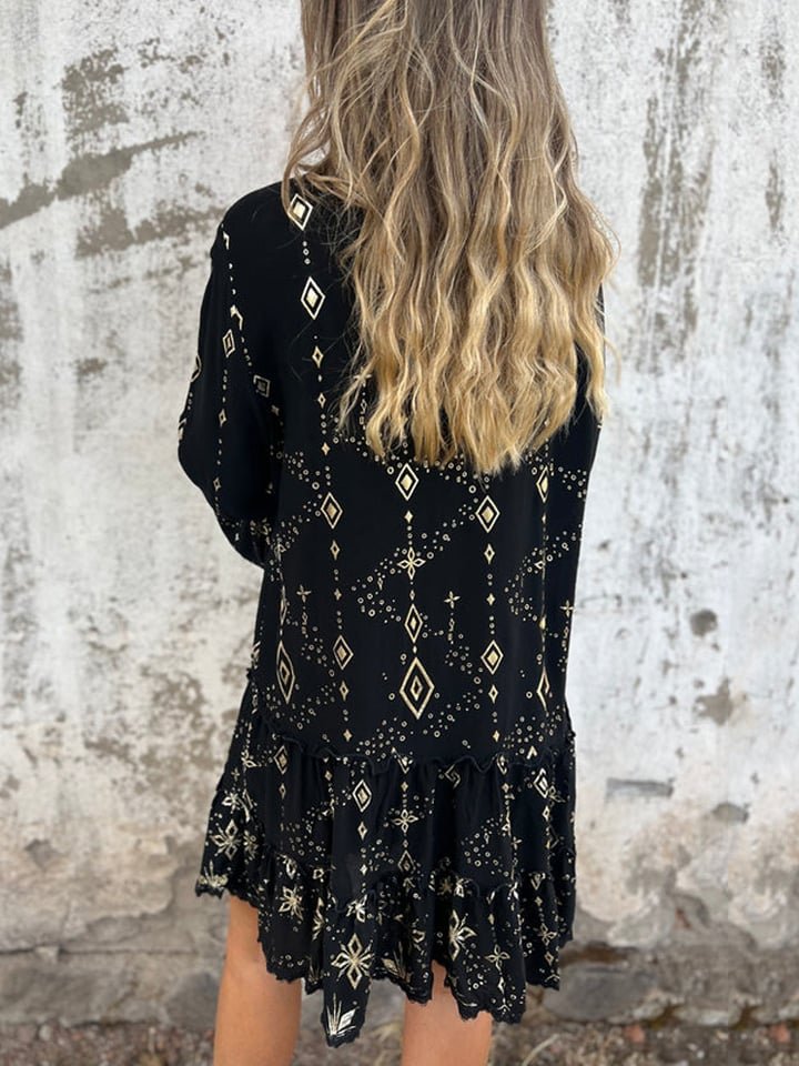 Women's black tiered boho V-neck dress with gold-tone accents and three-quarter sleeves.