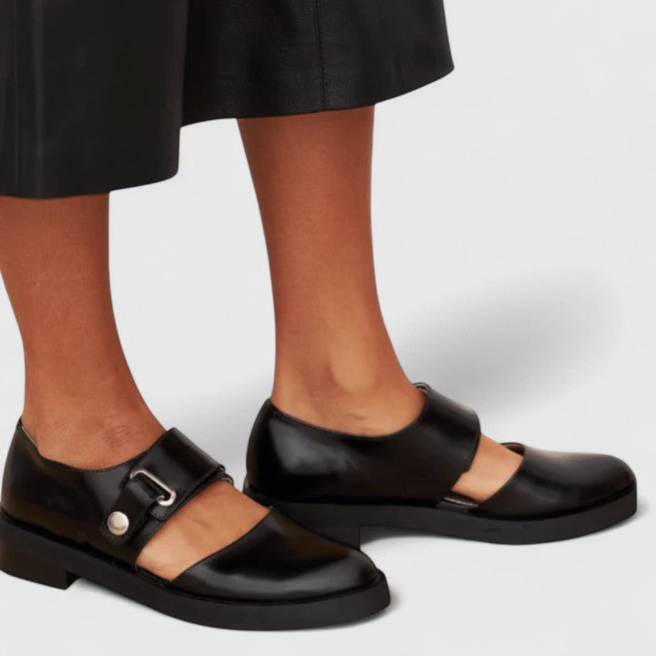 Elsie women's black leather Mary Jane shoes with a buckle strap and low heel.