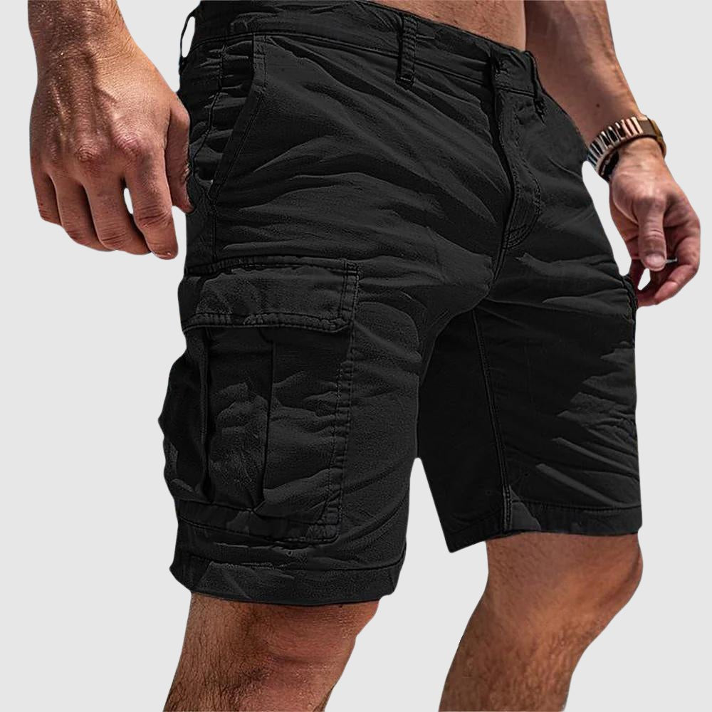 Men's black knee-length cargo shorts with side flap pockets and belt loops for easy utility style.