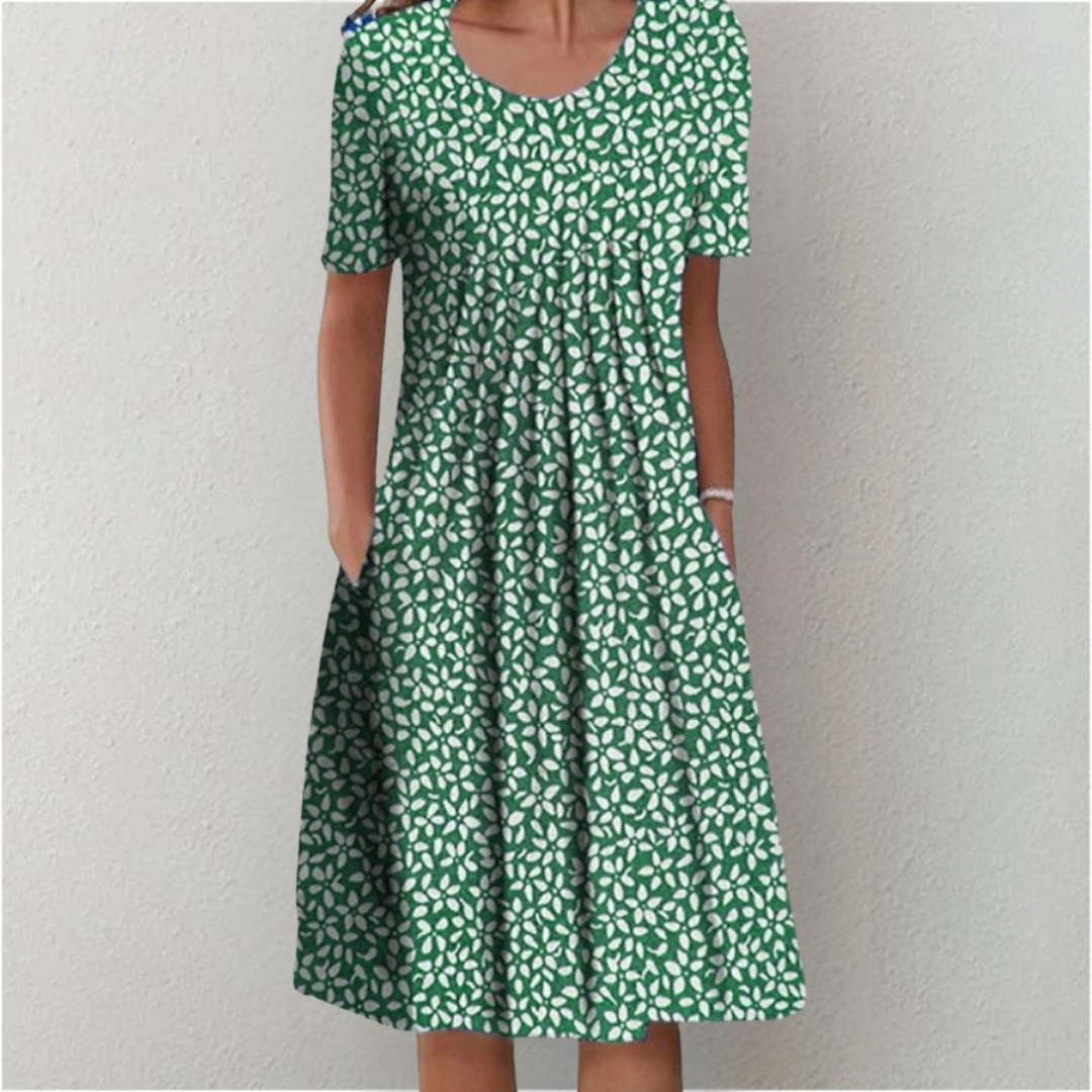 Green floral midi dress with pockets and short sleeves for women.