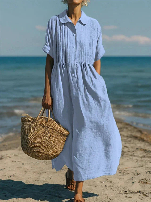 Hazel women's collared button midi dress in light blue, featuring a relaxed silhouette and front pleats, perfect for warm days.