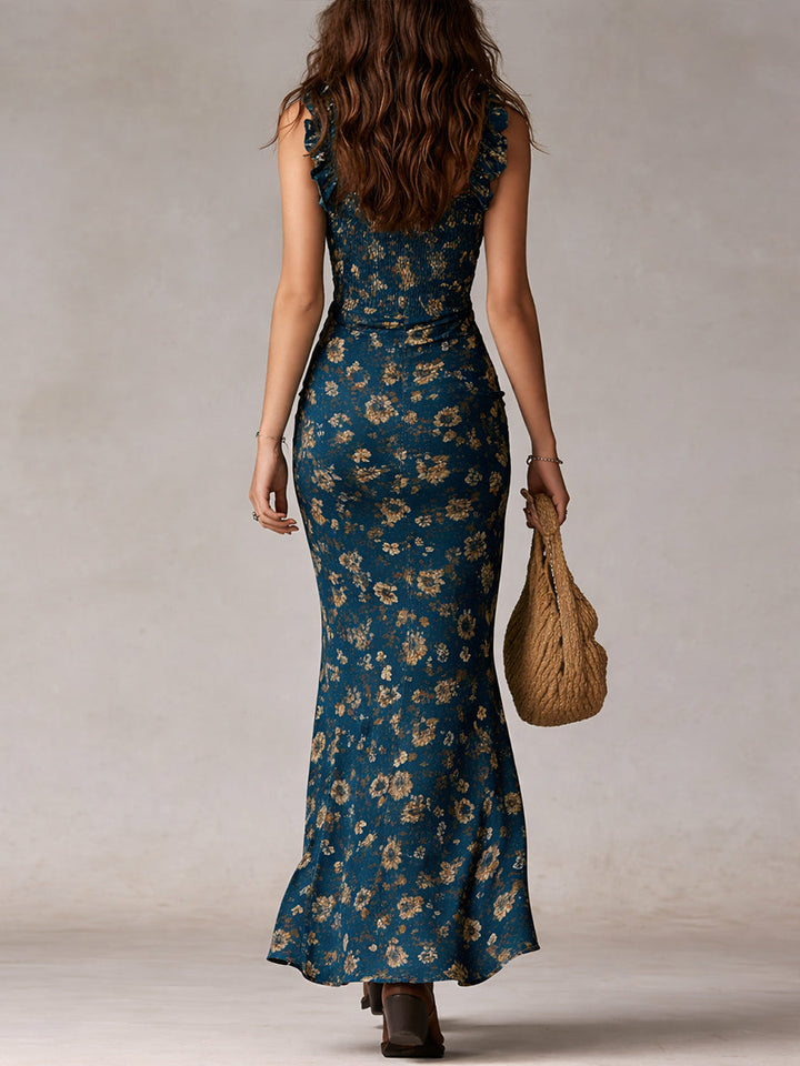 Back view of the Isabel floral boho maxi dress in teal with fluttery shoulder straps.