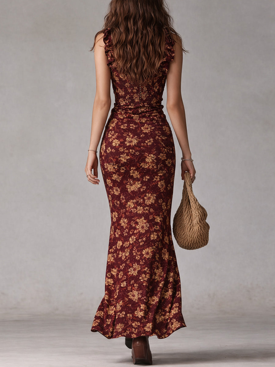 Back view of a woman in the Isabel maroon floral boho maxi dress with a smocked back.