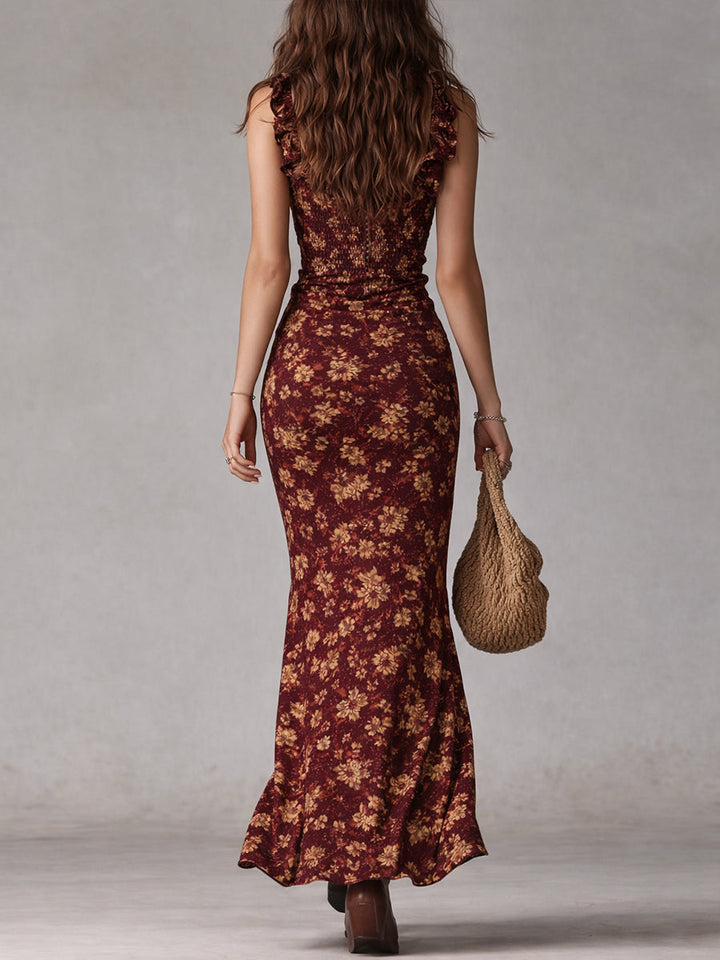 Back view of a woman in the Isabel maroon floral boho maxi dress with a smocked back.