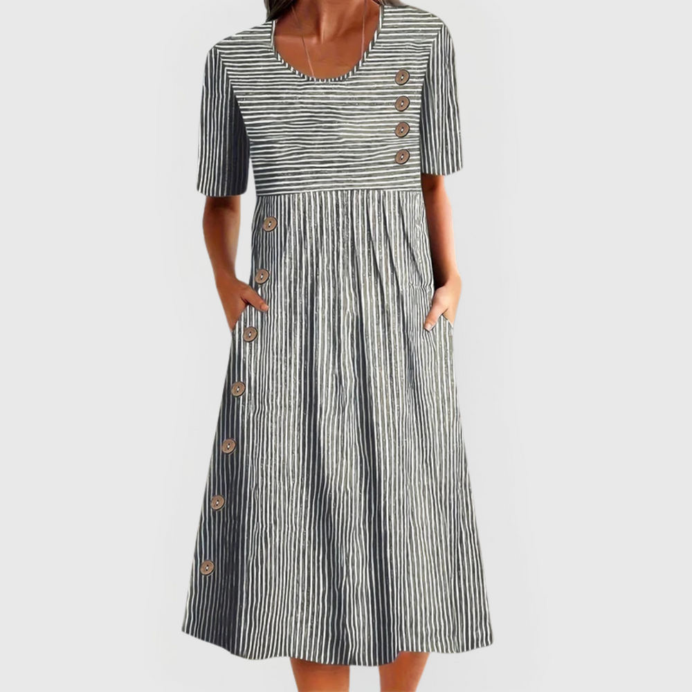 Isla women's striped midi dress with 3/4 sleeves, flattering length, and decorative buttons.