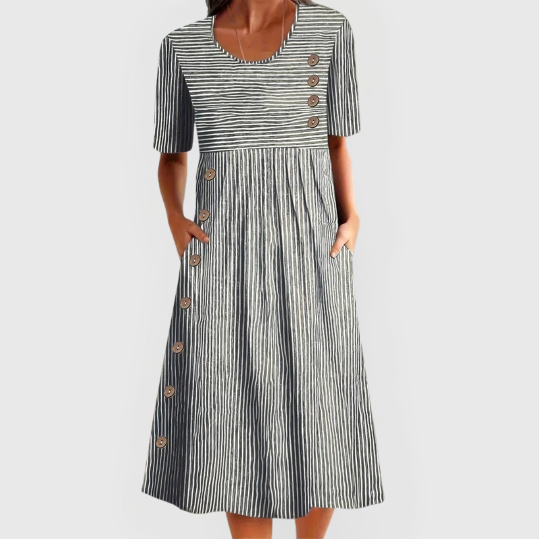 Isla women's striped midi dress with 3/4 sleeves, flattering length, and decorative buttons.