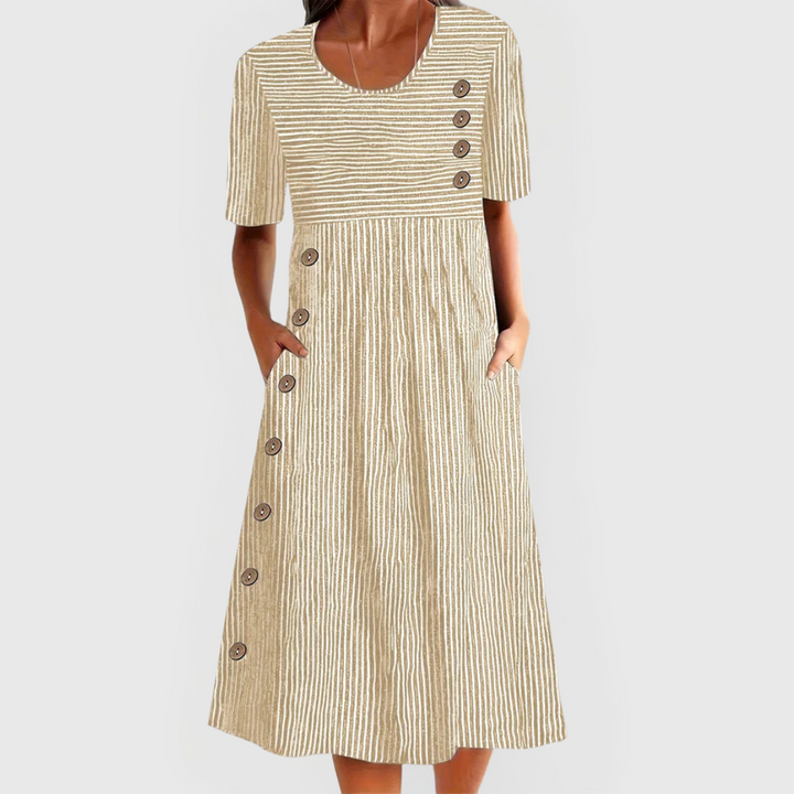Isla women's striped midi dress in a light beige, featuring a classic design, 3/4 sleeves, and decorative buttons.