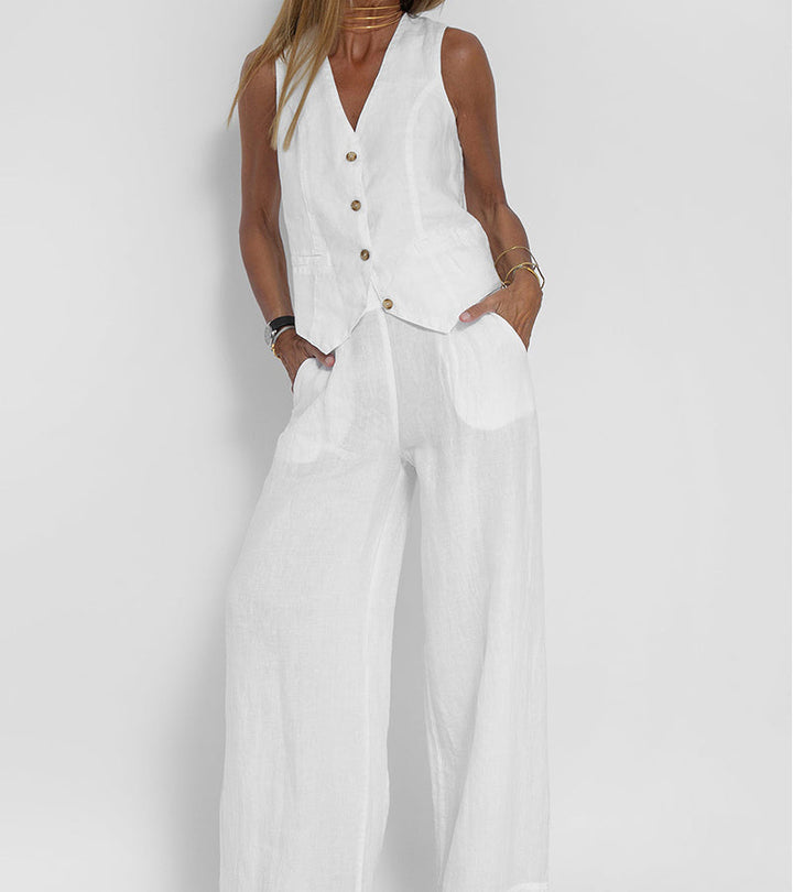 White Jhoana women's linen vest and wide-leg pants set with brown buttons.