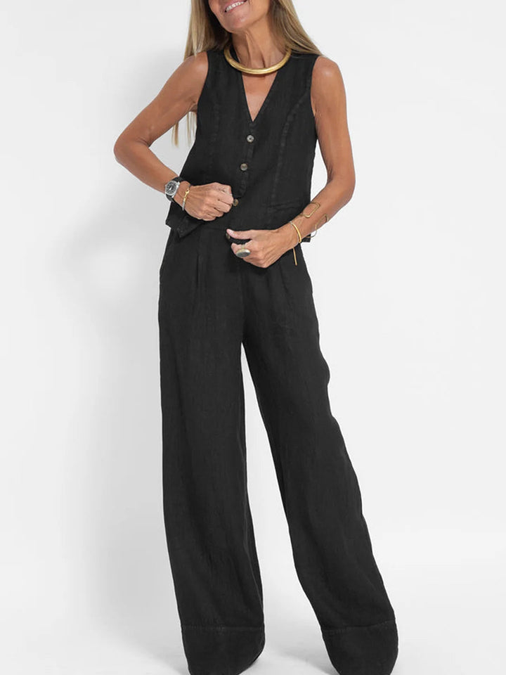 Woman wearing a black linen sleeveless V-neck vest and wide-leg pants set.