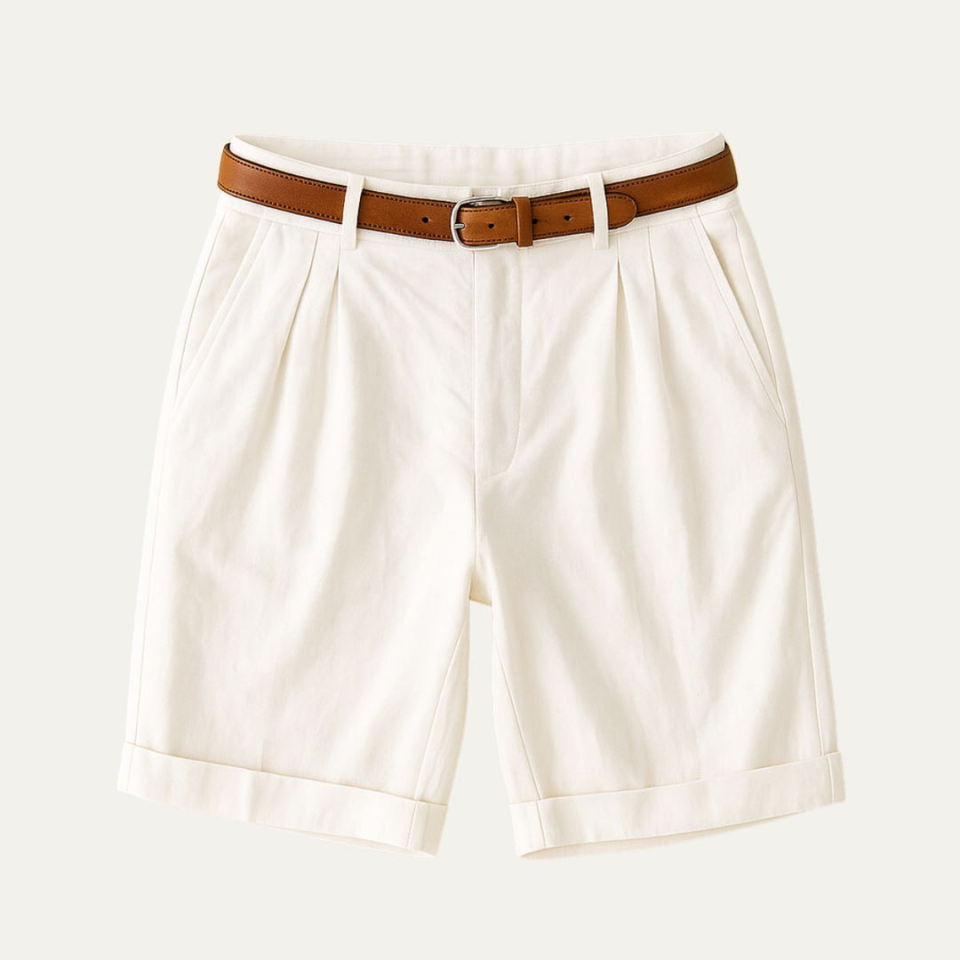 Julian Men's Pleated Chino Shorts in white with a brown leather belt, cuffed hems, and side pockets.
