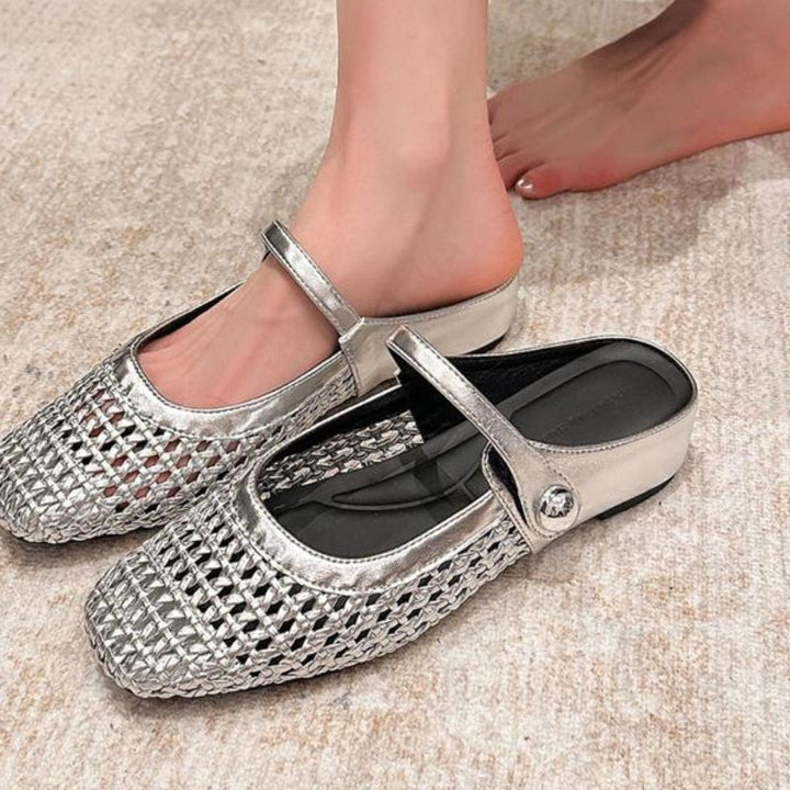 Beige woven orthopedic mule flats with a Mary Jane strap.