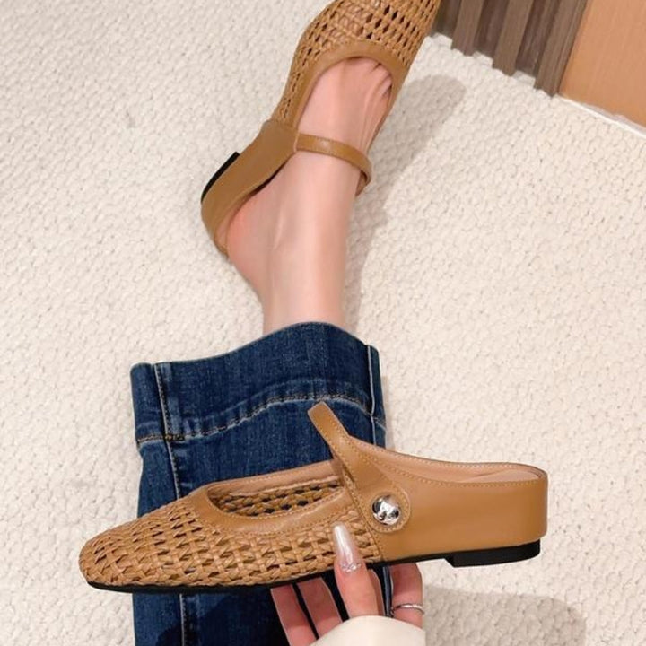 Tan woven leather Mary Jane flat mules with an open-back slip-on design.