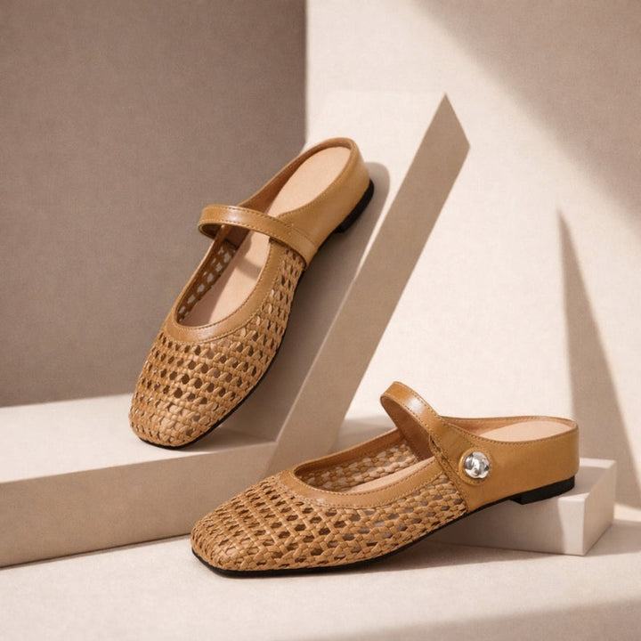 Tan woven leather Mary Jane flat mules with a slip-on design and silver button detail.