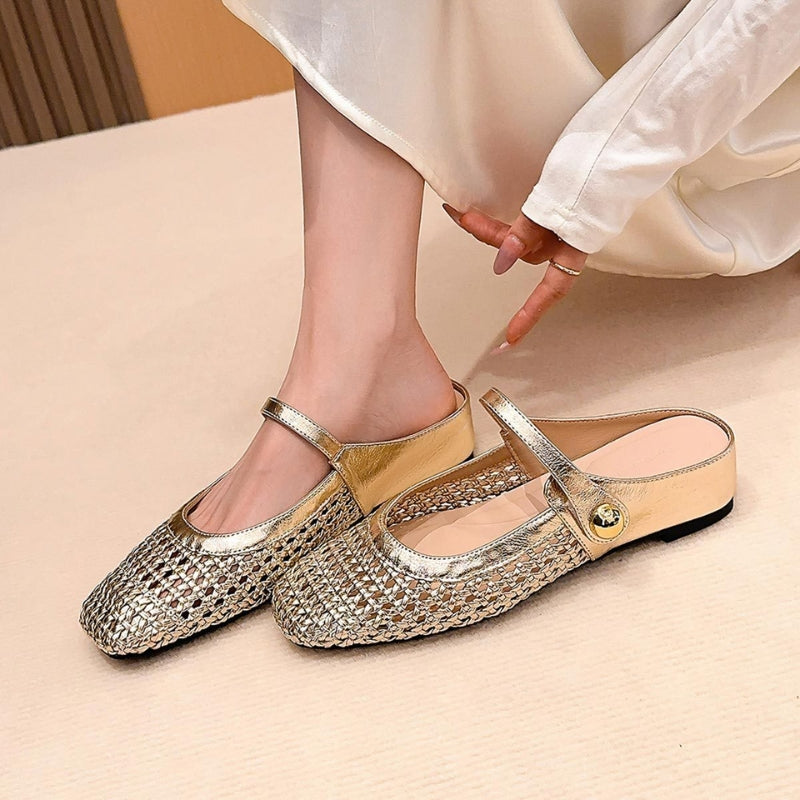 Gold woven flat slip-on Mary Jane mules with a metallic finish and a single strap.