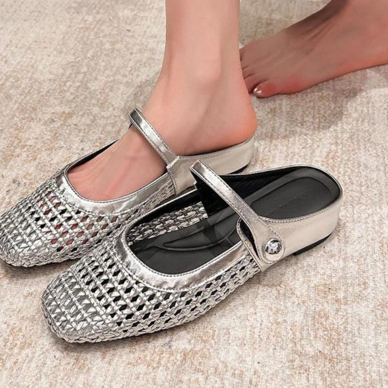 Silver woven Mary Jane slip-on mules with a metallic finish and flat sole.