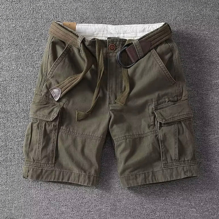 Men's Logan olive green cargo shorts with a brown belt, button-front waist, and utility pockets.