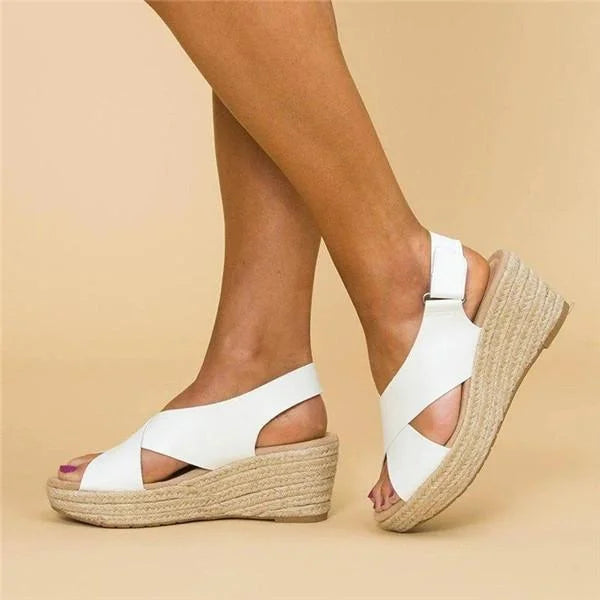 Brown leather orthopedic wedge sandals with cushioned footbed and adjustable straps.