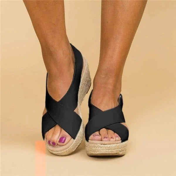Black women's orthopedic wedge sandals with a cushioned footbed and adjustable strap.