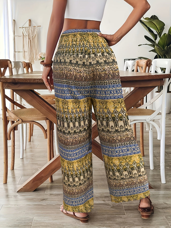 Women's Lyra boho print wide leg pants with a colorful pattern, drawstring waist, and flowing fit.