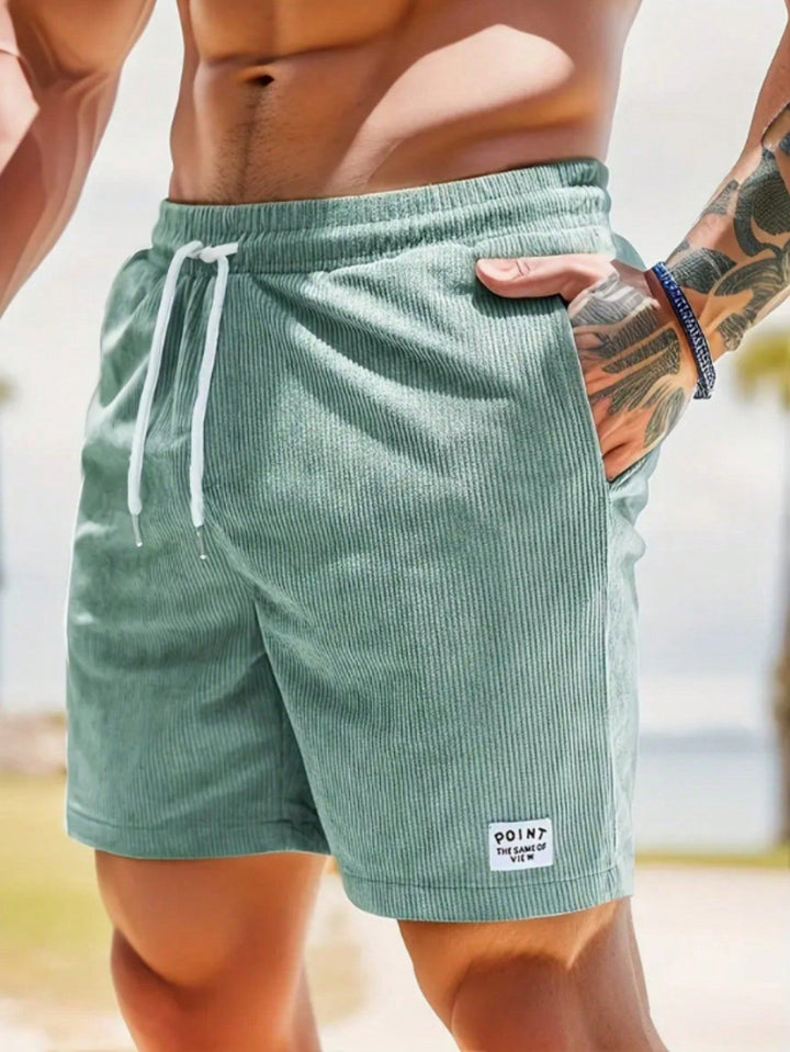 Men's Mason drawstring casual shorts in a relaxed fit, light green corduroy, with white drawstrings and a side pocket.