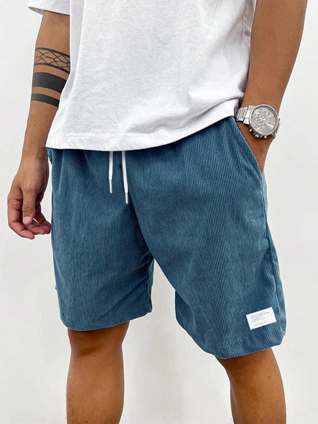 Men's Mason drawstring casual shorts in a relaxed fit, featuring blue corduroy fabric and a white drawstring.