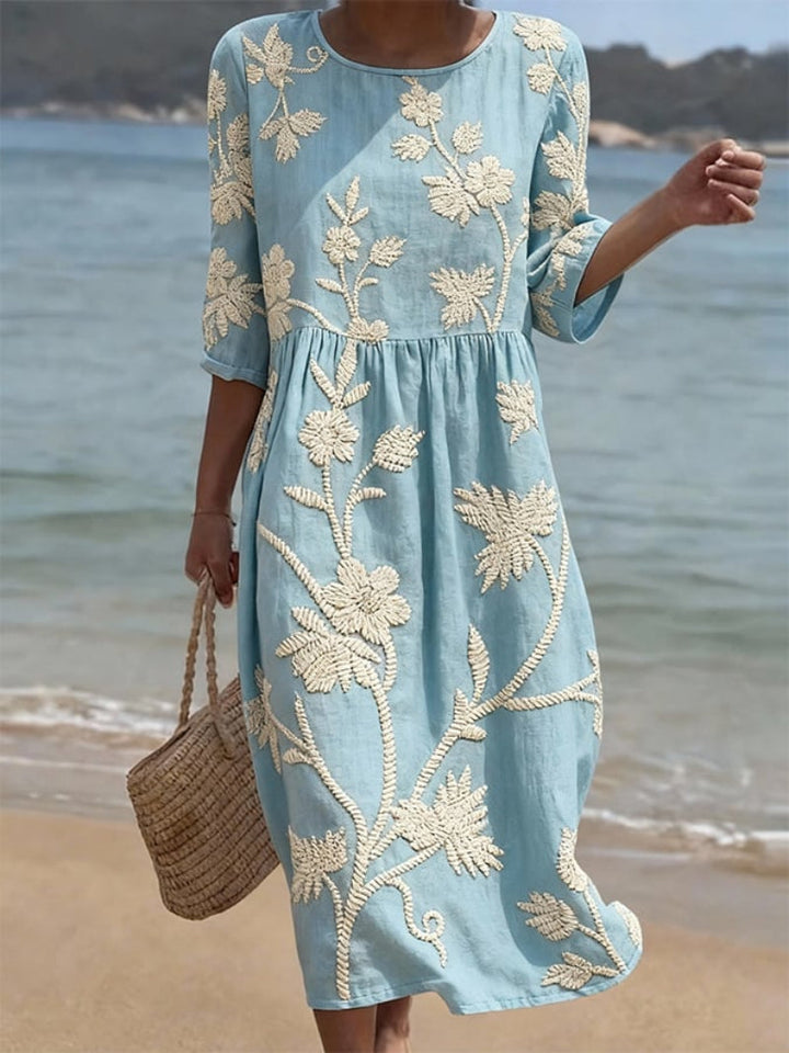 Mia women's floral round neck midi dress in light blue with delicate cream embroidery, perfect for warm-weather style.