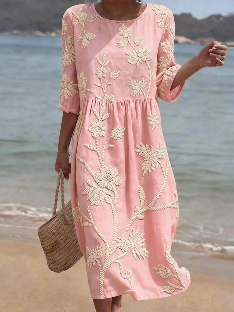 Mia women's pink floral midi dress with a round neck, relaxed fit, and delicate white embroidery.