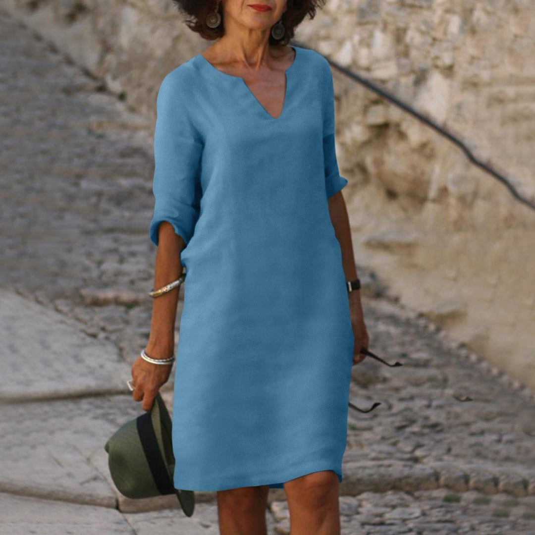 Mia women's blue lightweight summer dress with a flattering V-neck, 3/4 sleeves, and a clean silhouette.