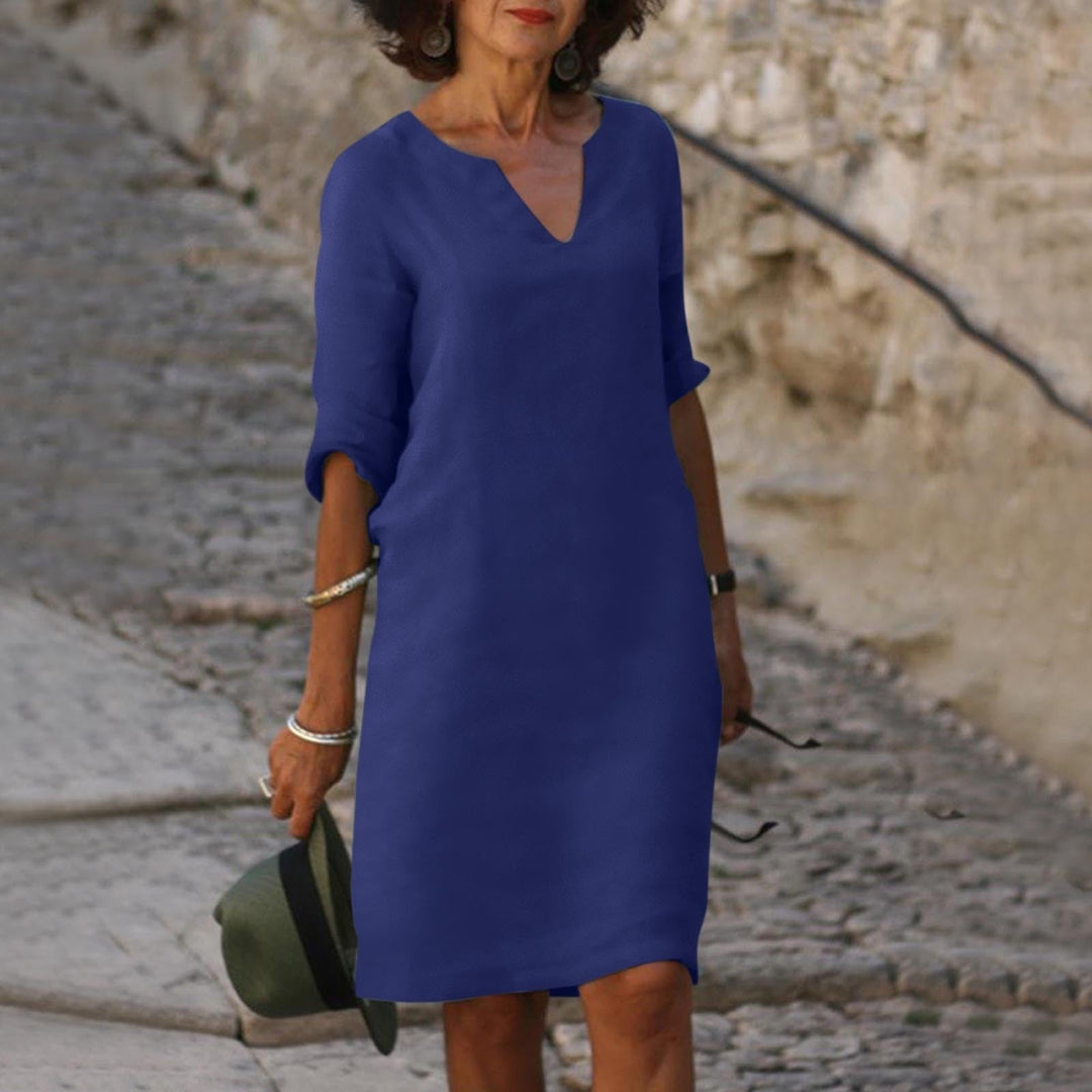 Mia women's summer dress in a flattering navy blue, featuring a clean silhouette and lightweight fabric.