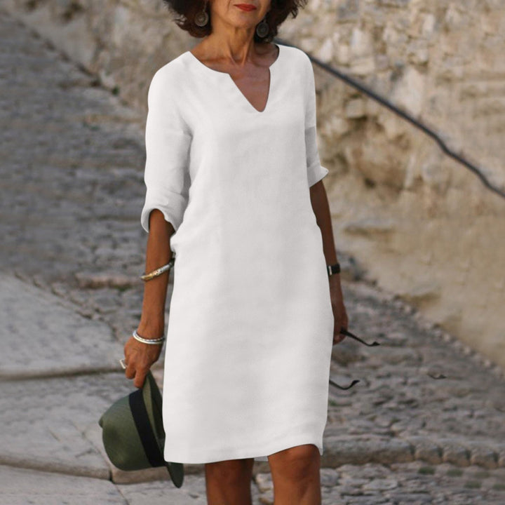 Mia women's white lightweight summer dress with a flattering V-neck and 3/4 sleeves, perfect for warm-weather elegance.
