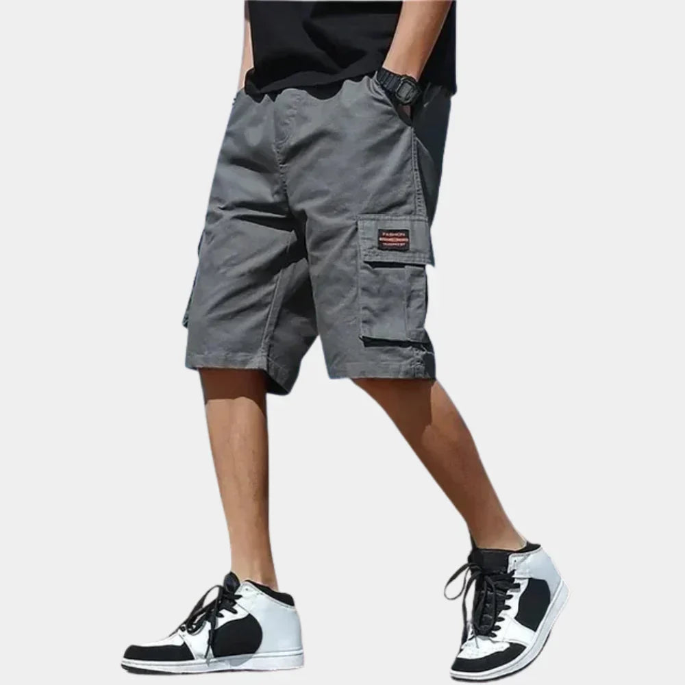 Men's grey cargo shorts with side pockets, drawstring waist, and loose fit for casual summer wear.