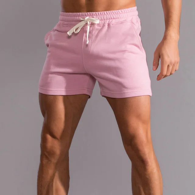 Miles Men's Slim Fit Drawstring Shorts in soft pink, featuring an elastic waistband and mid-thigh cut.