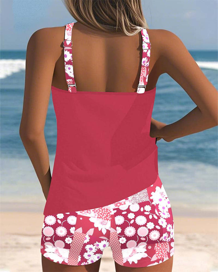 Women's Mirelle tankini with shorts, black top, and floral print bottoms.